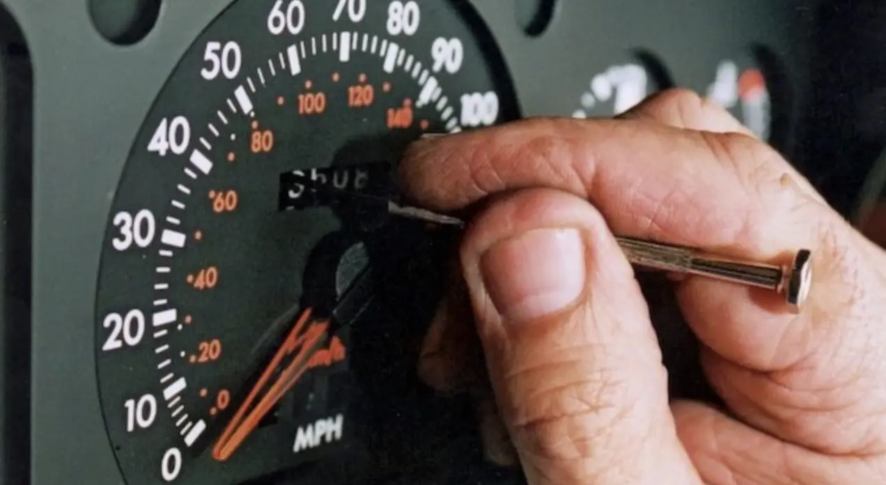 Hero image — car dashboard or odometer close-up, wide shot