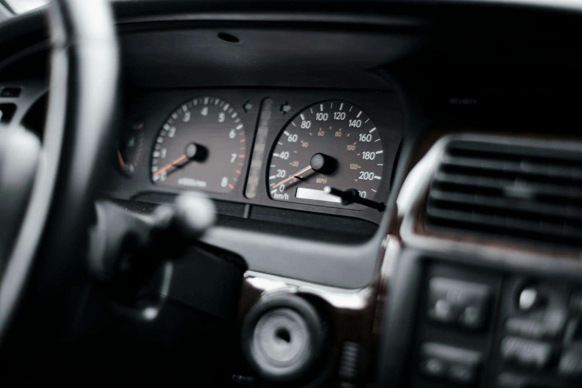 Hero image — car dashboard or odometer close-up, wide shot